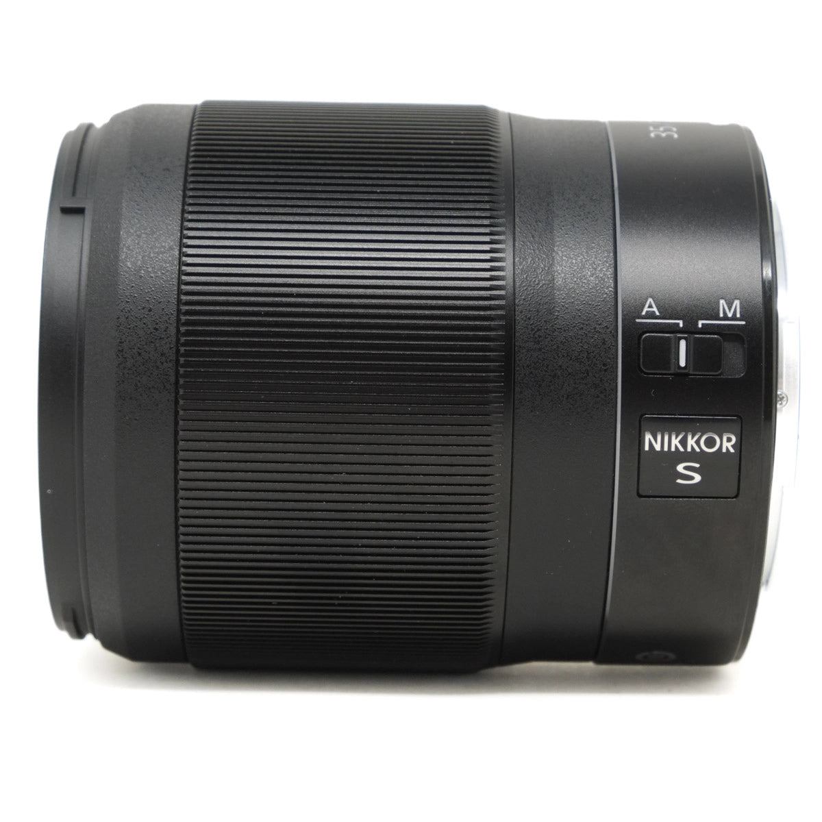 Camera lens with 'Nikkor S' branding on a white background