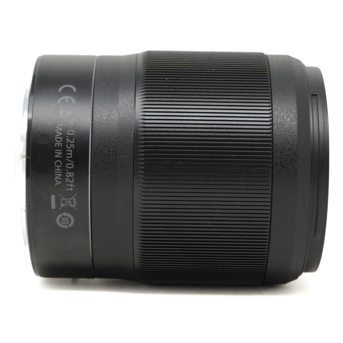 Black camera lens on a white background