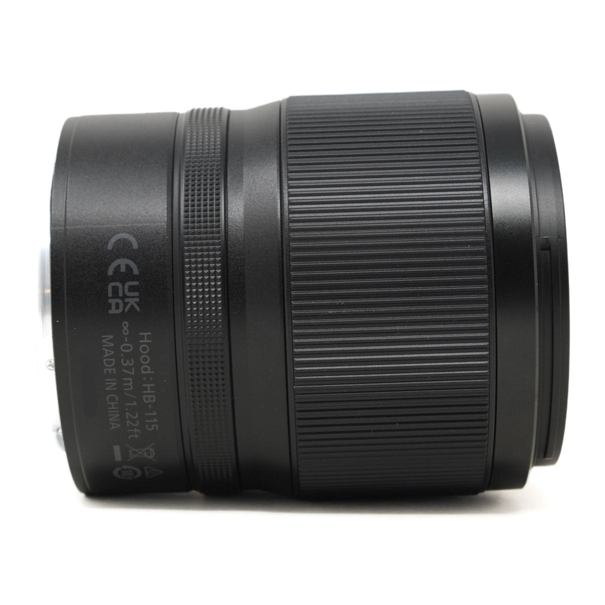 Black camera lens with text on a white background