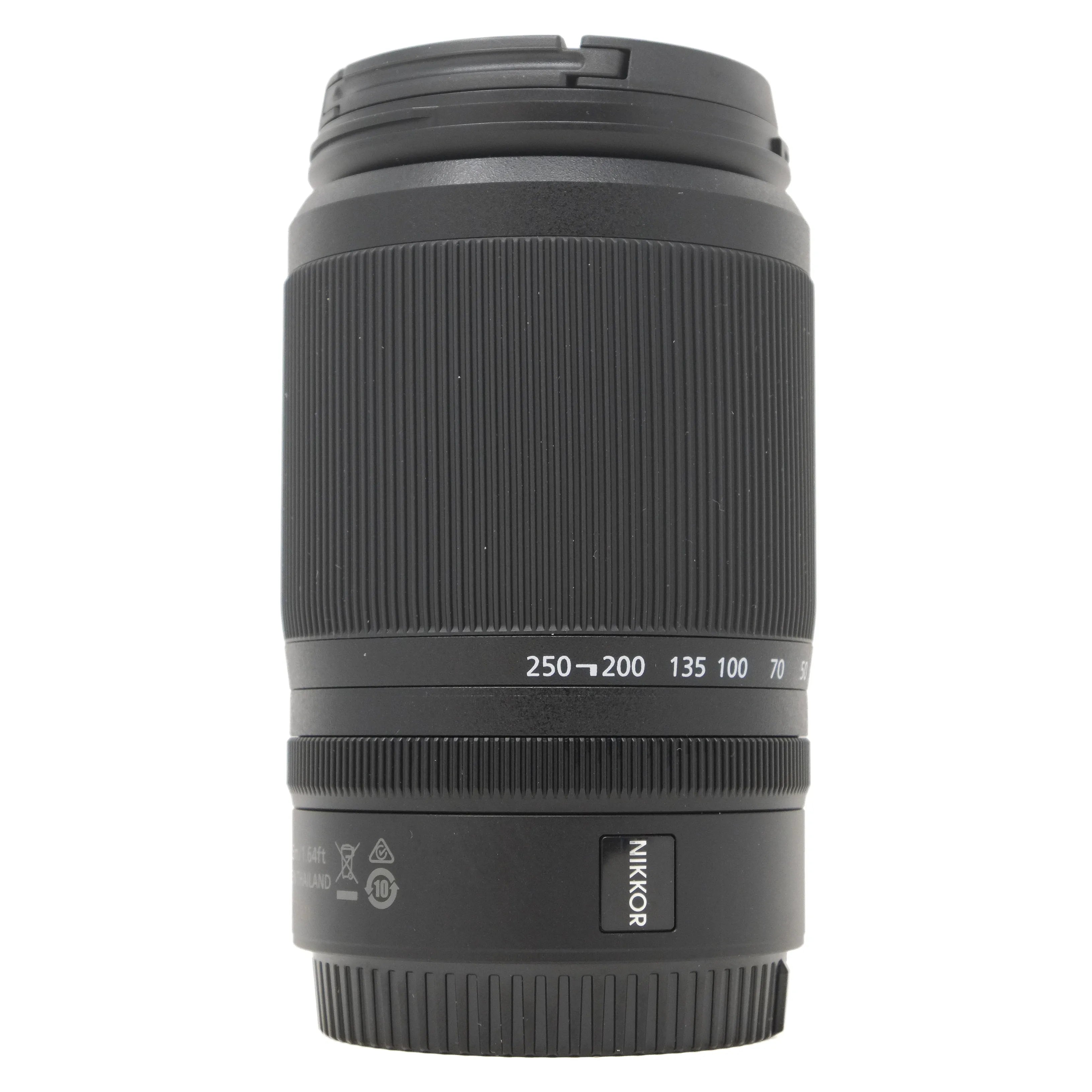 Black camera lens with 'Nikon' branding on a white background