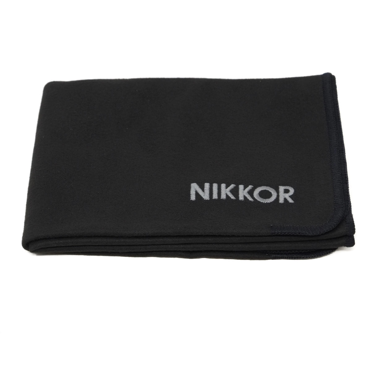 Black cloth with 'Nikkor' branding on a white background