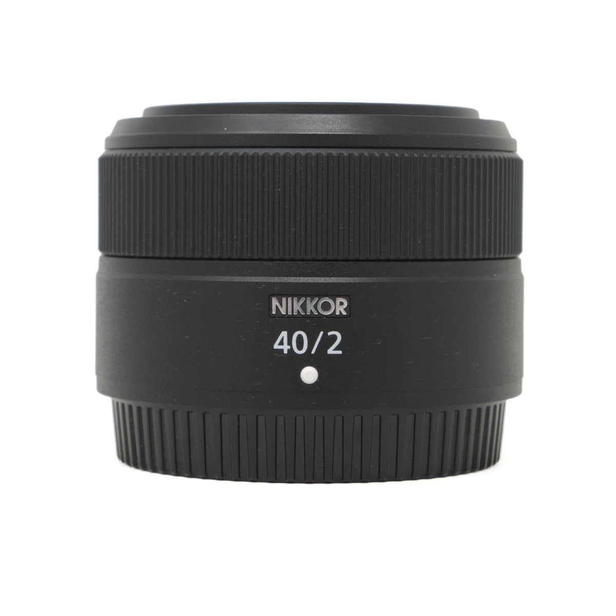 Black Nikkor camera lens on a white background