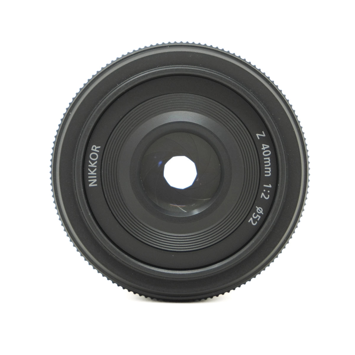 Camera lens with 'Nikkor' branding on a white background