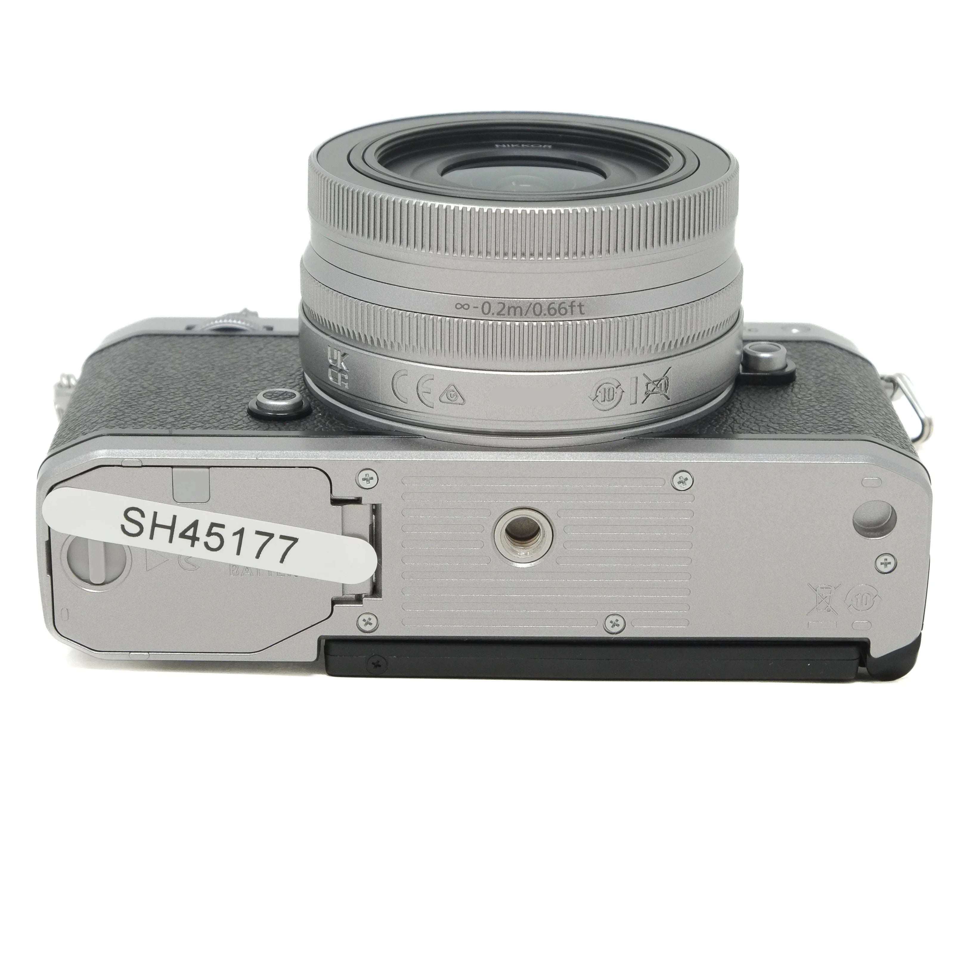 Silver camera with lens on a white background