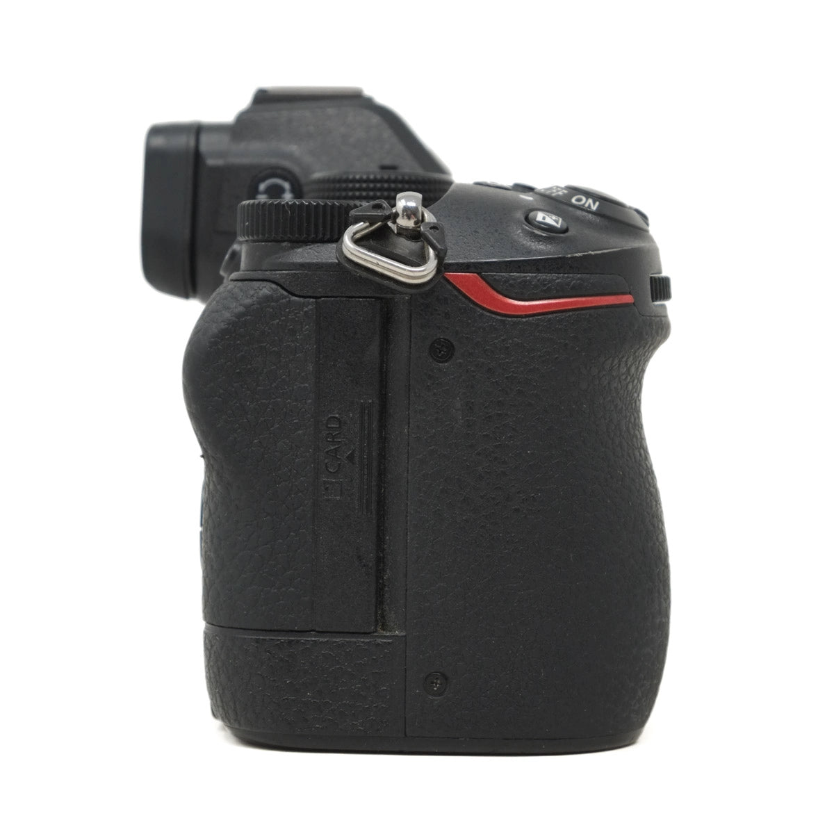 Black camera body with red accent on a white background