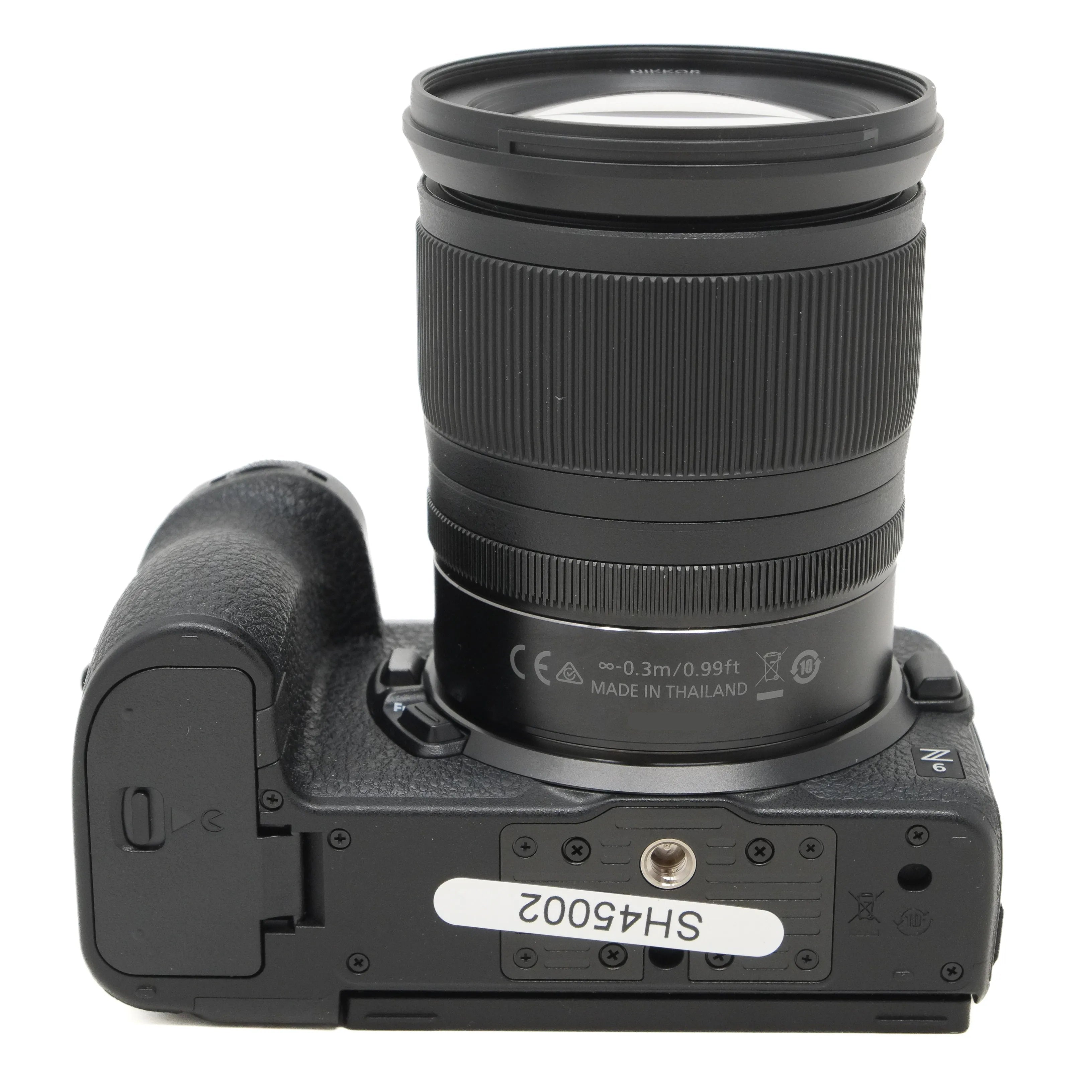 Camera body with lens on a white background