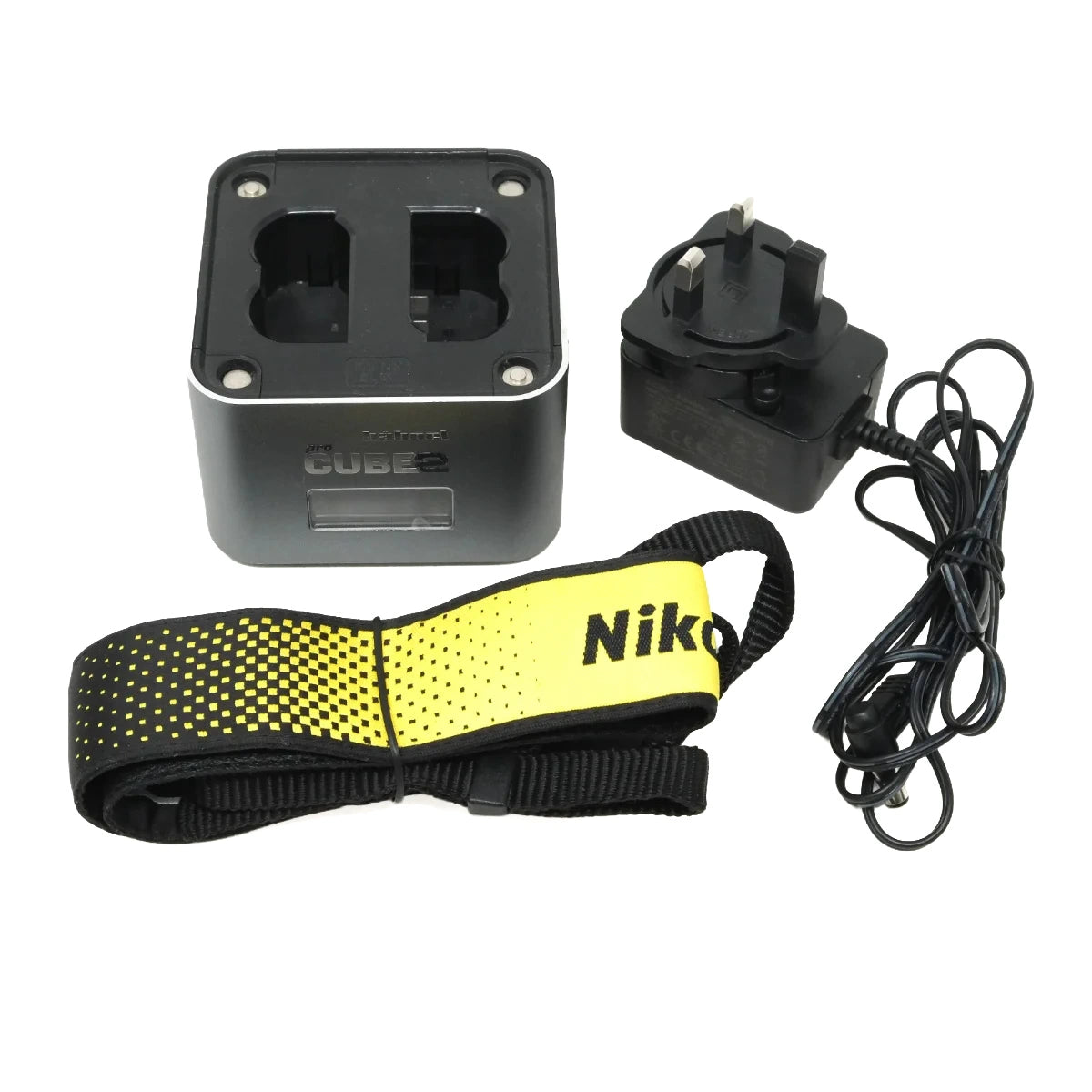 A Cube 8 power bank kit on a white background, including a black Cube 8 battery, a yellow and black wrist strap with 'Nikon' printed on it, and a black UK wall charger.