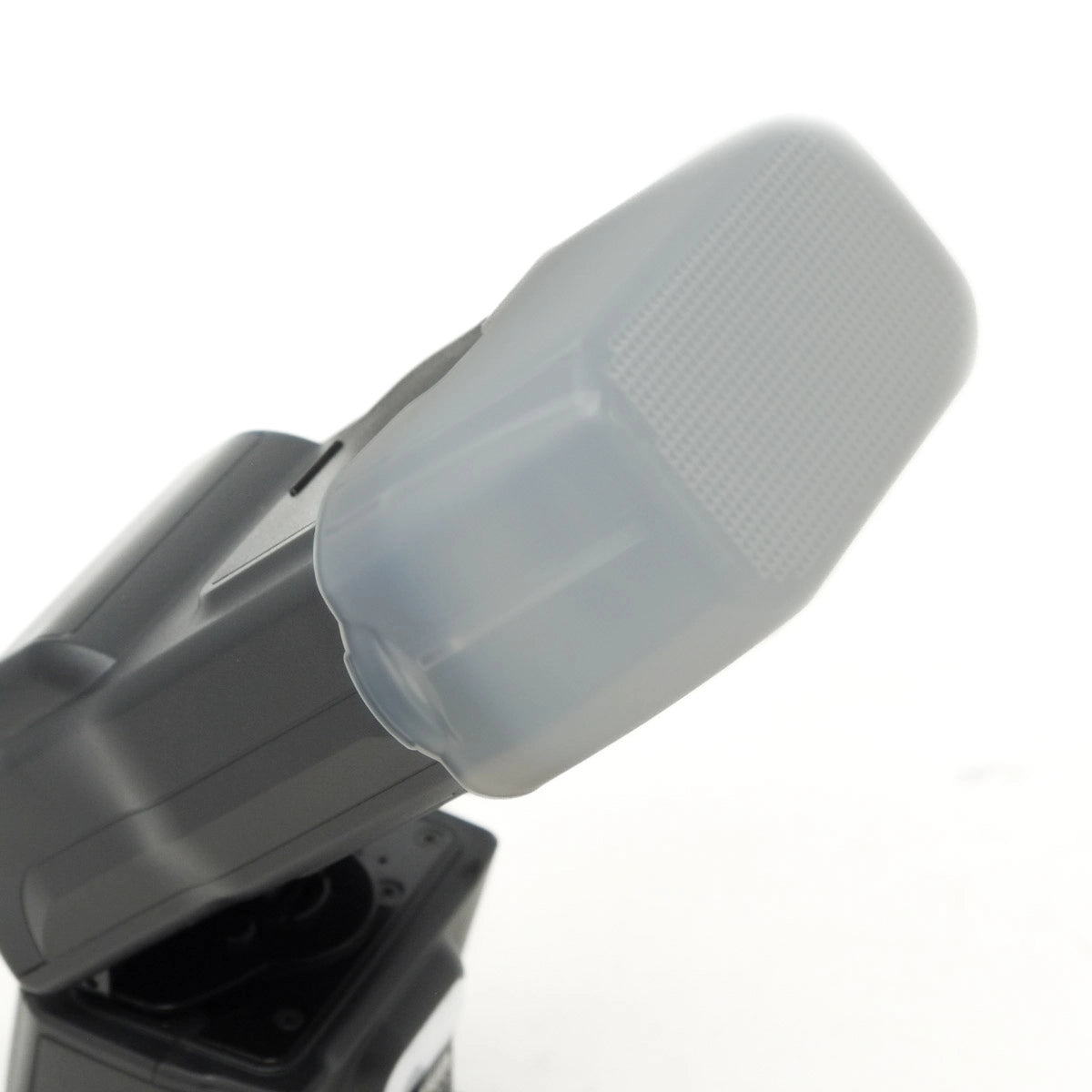 Nissin digital camera flash with diffuser on a white background 