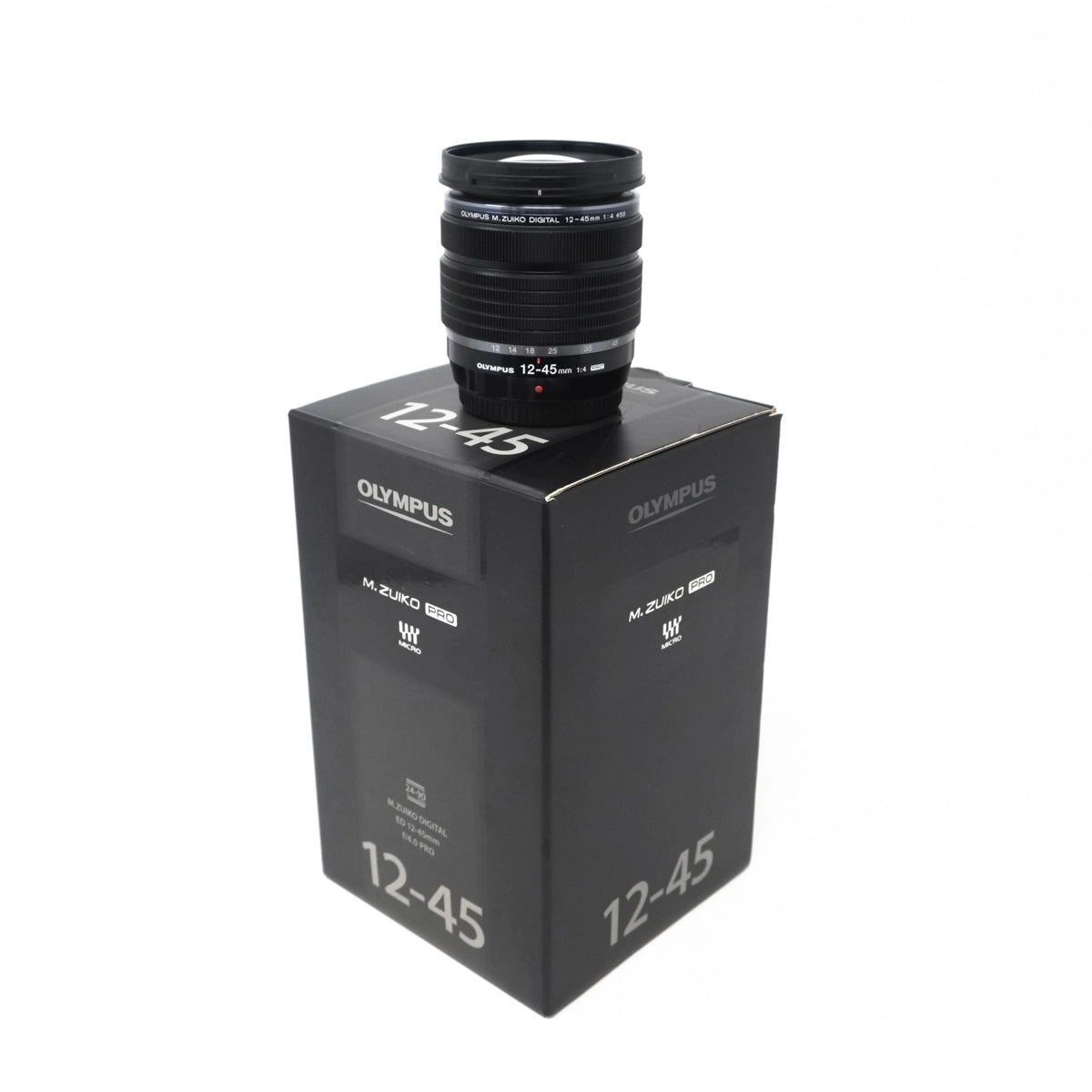 Used OM System 12-45mm F4 Pro Lens - Boxed - Front angle with box 