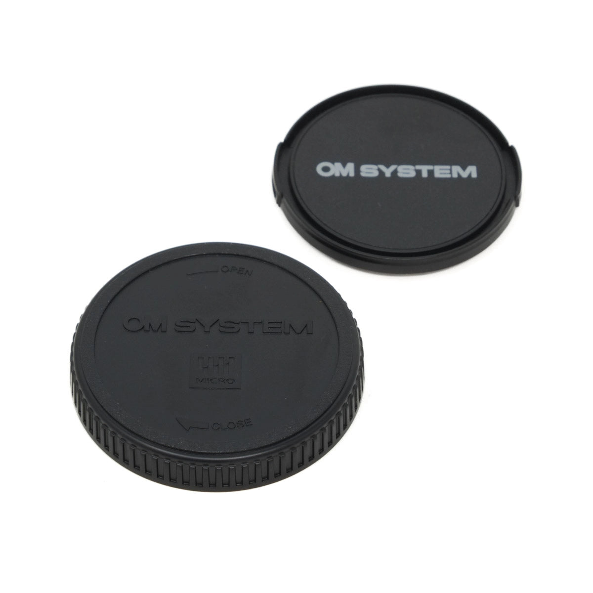 Two black camera lens caps with 'OM SYSTEM' branding on a white background