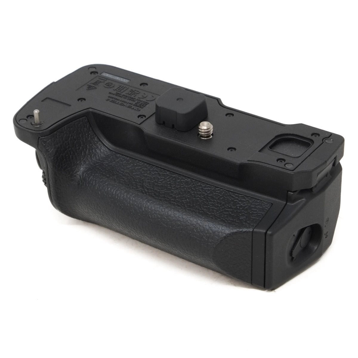 Black camera battery grip on a white background