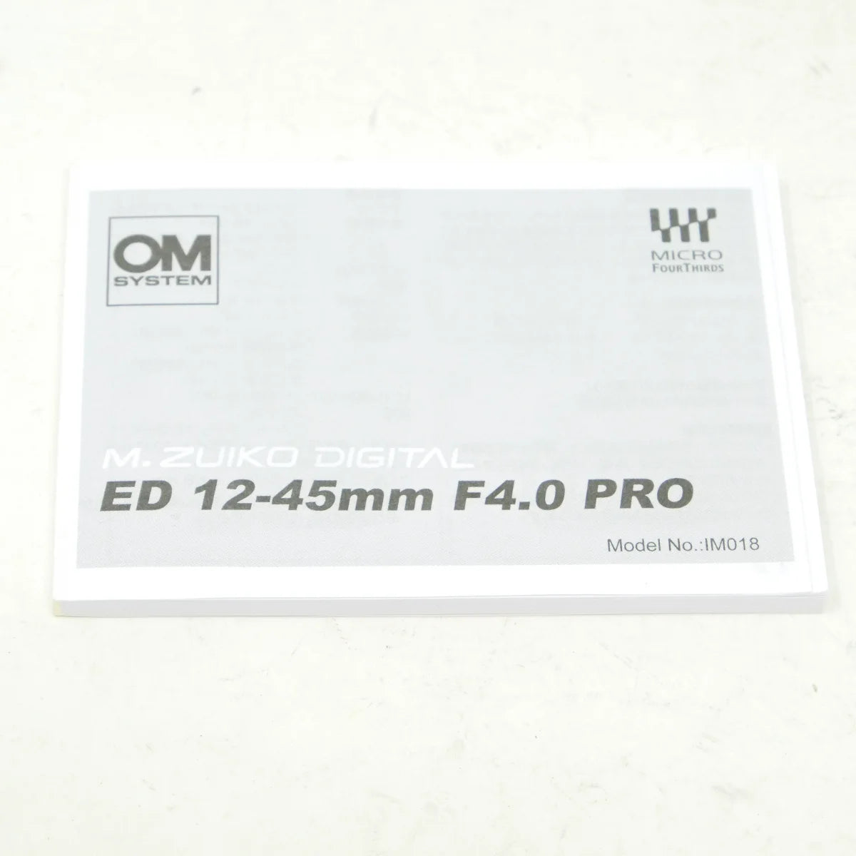 Used OM System M.Zuiko PRO 12-45mm F4 ED Lens - instructions 