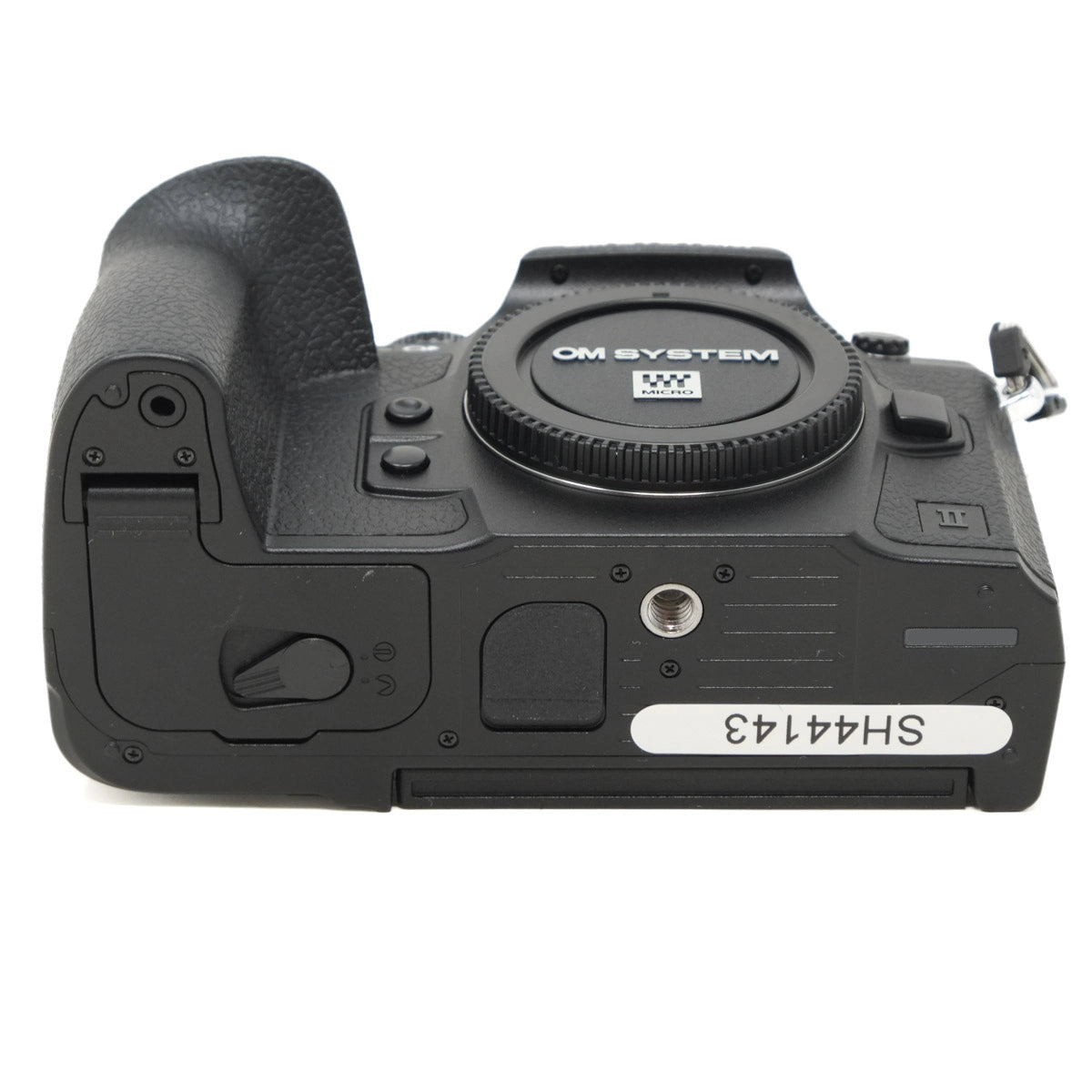 Camera body with 'OM SYSTEM' branding on a white background