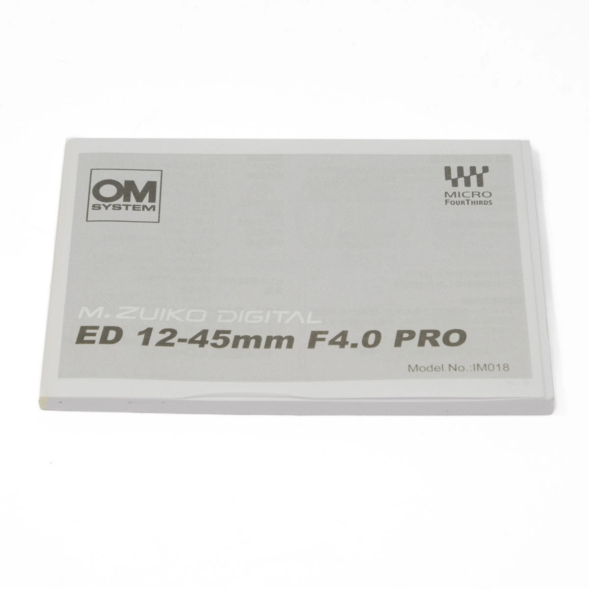 M.Zuiko Digital ED 12-45mm F4.0 PRO lens packaging on a white background