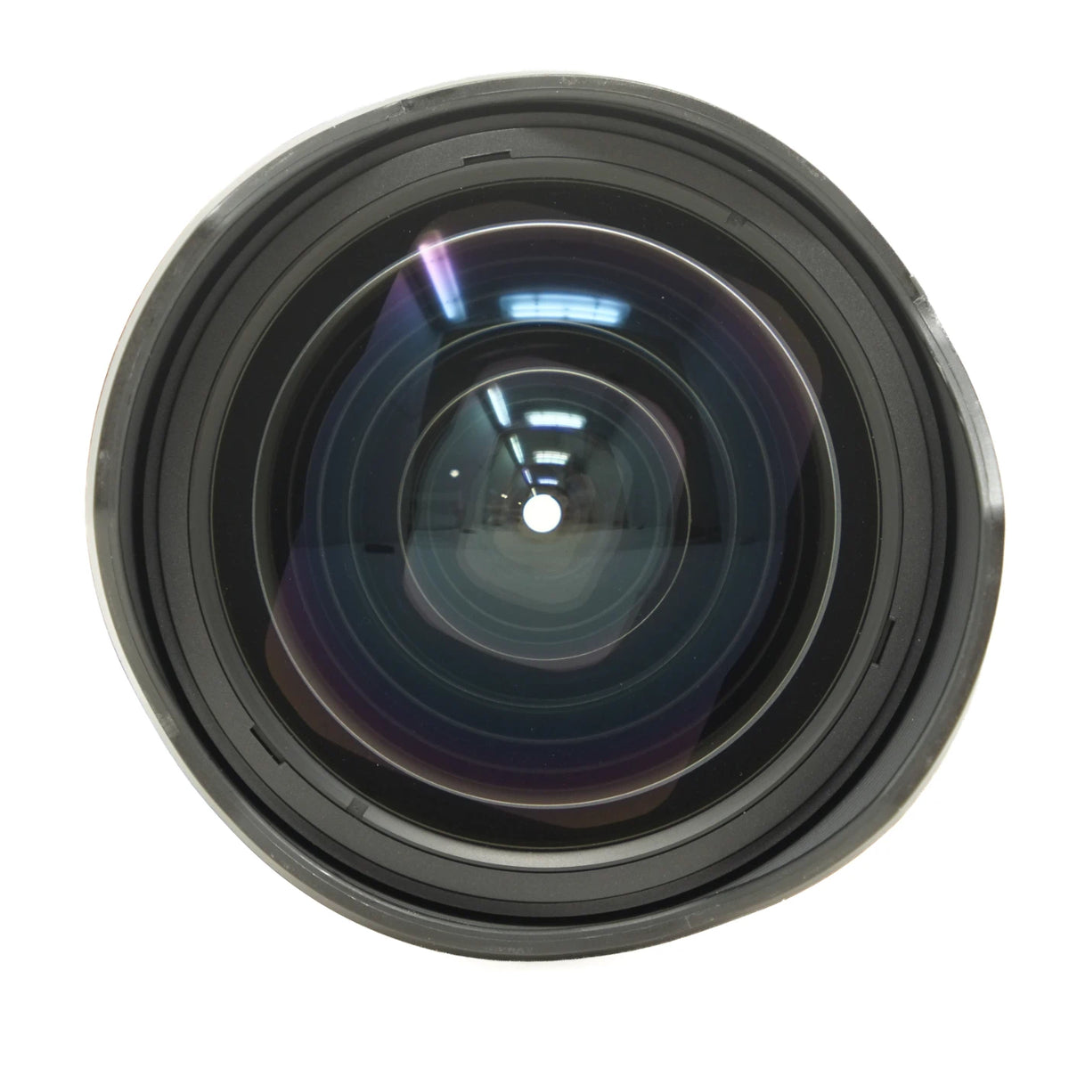 A close-up studio shot of a black camera lens with multiple glass lens elements, shown against a solid white background.