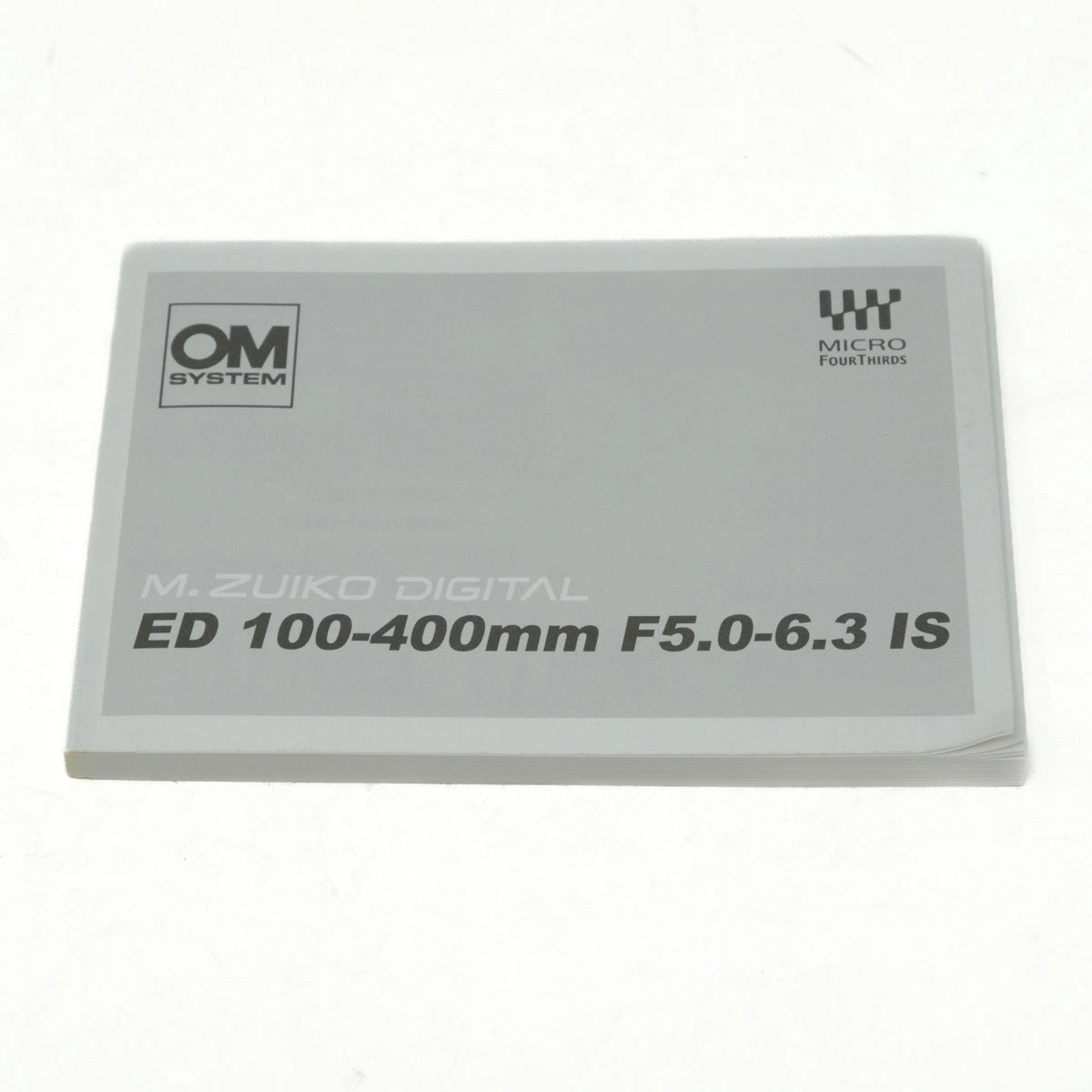 M.Zuiko Digital ED 100-400mm F5.0-6.3 IS lens manual on a white background