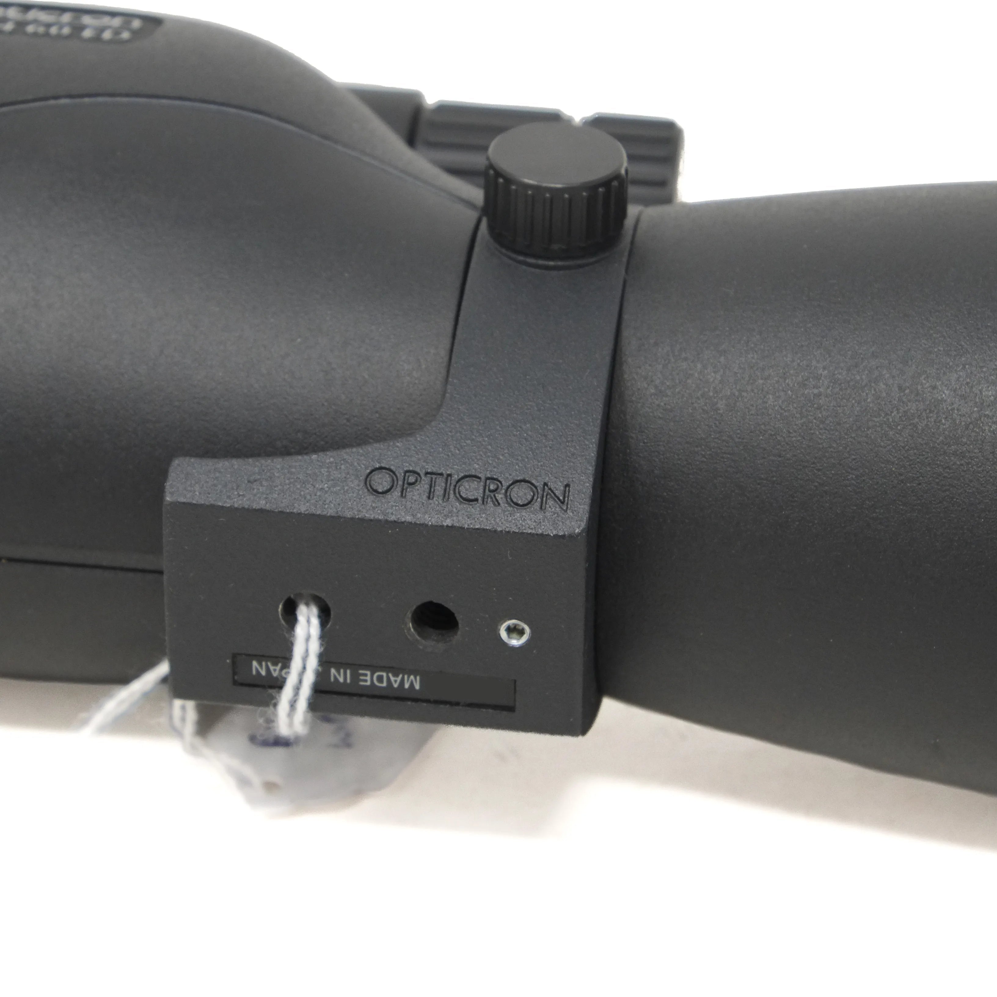 Close-up of an Opticron spotting scope on a white background