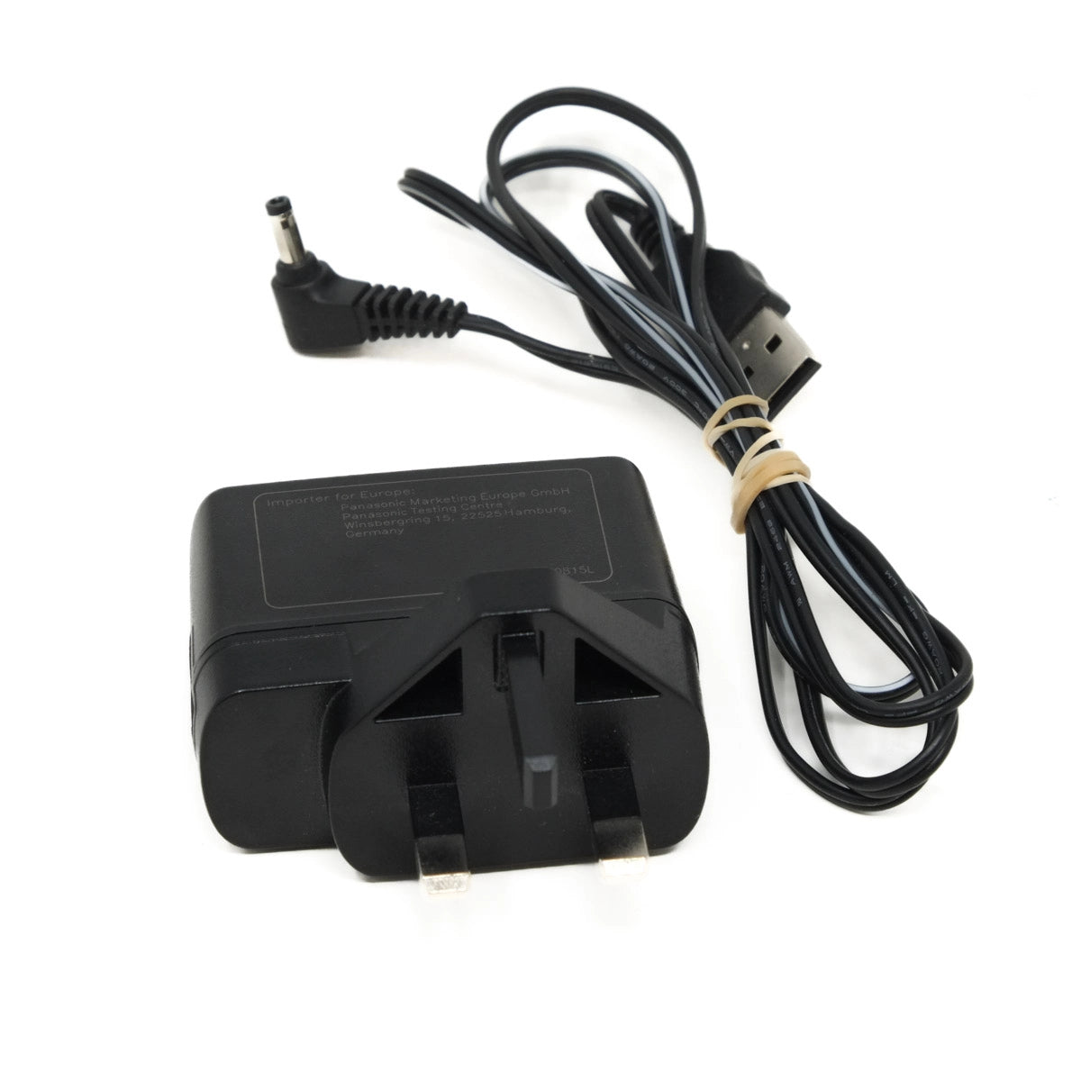 Black power adapter with USB cable on a white background