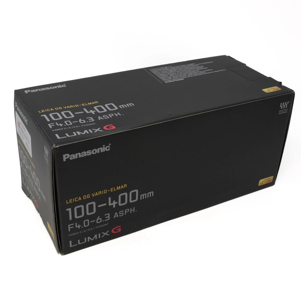 Black box packaging of Panasonic Lumix G camera lens on a white background