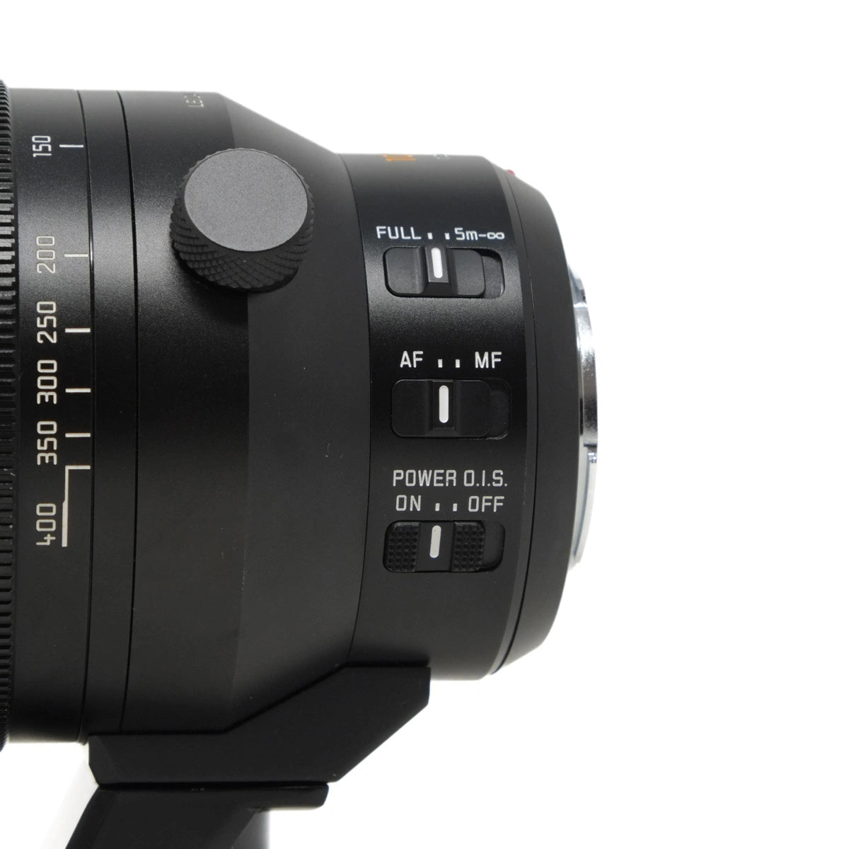 Close-up of a camera lens with control buttons on a white background