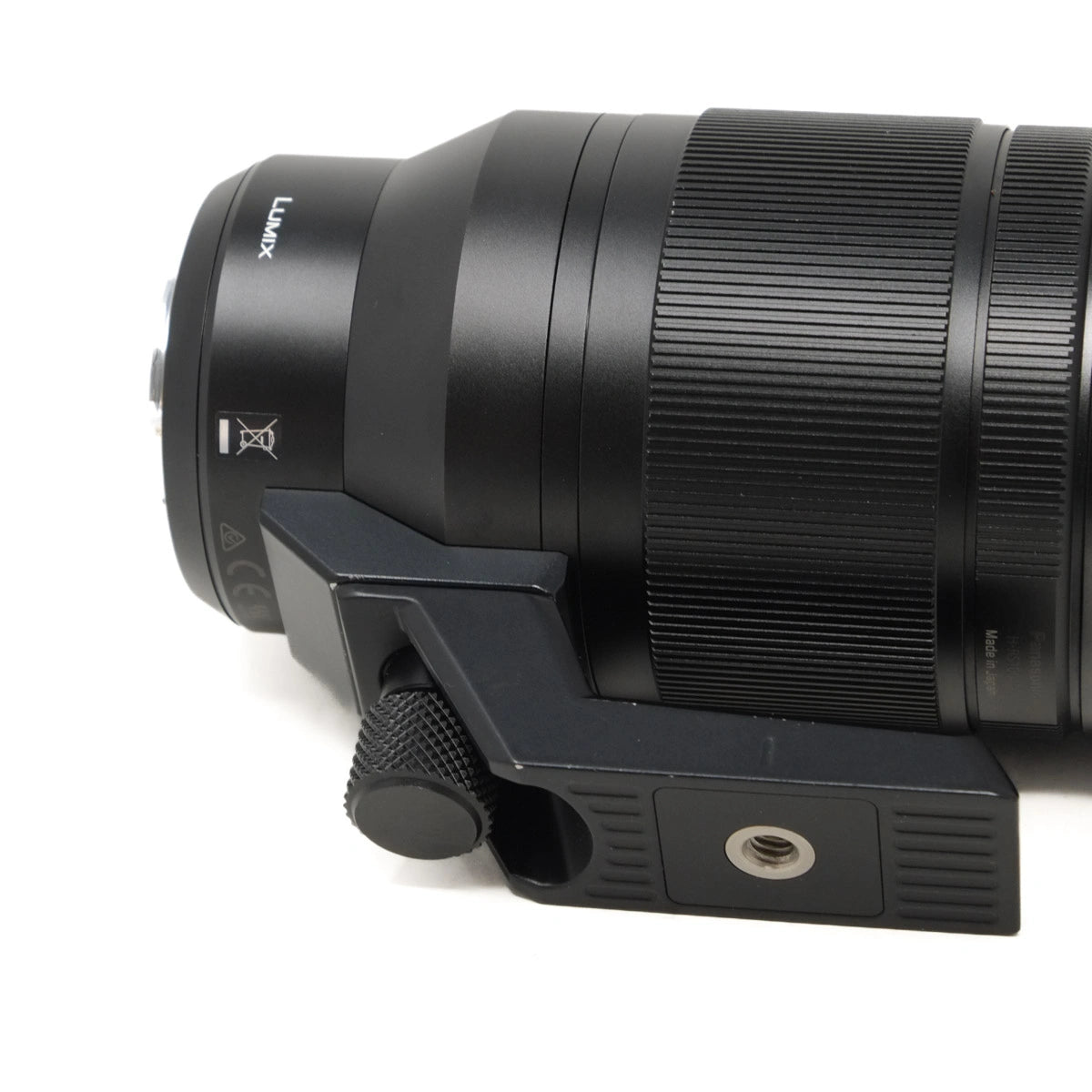 Camera lens with a focus control ring on a white background