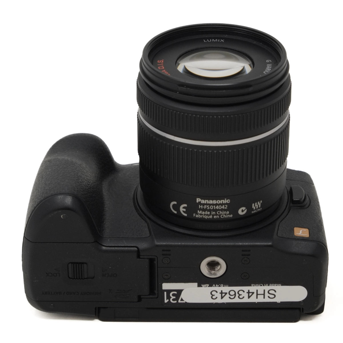 Black Panasonic camera with lens on a white background