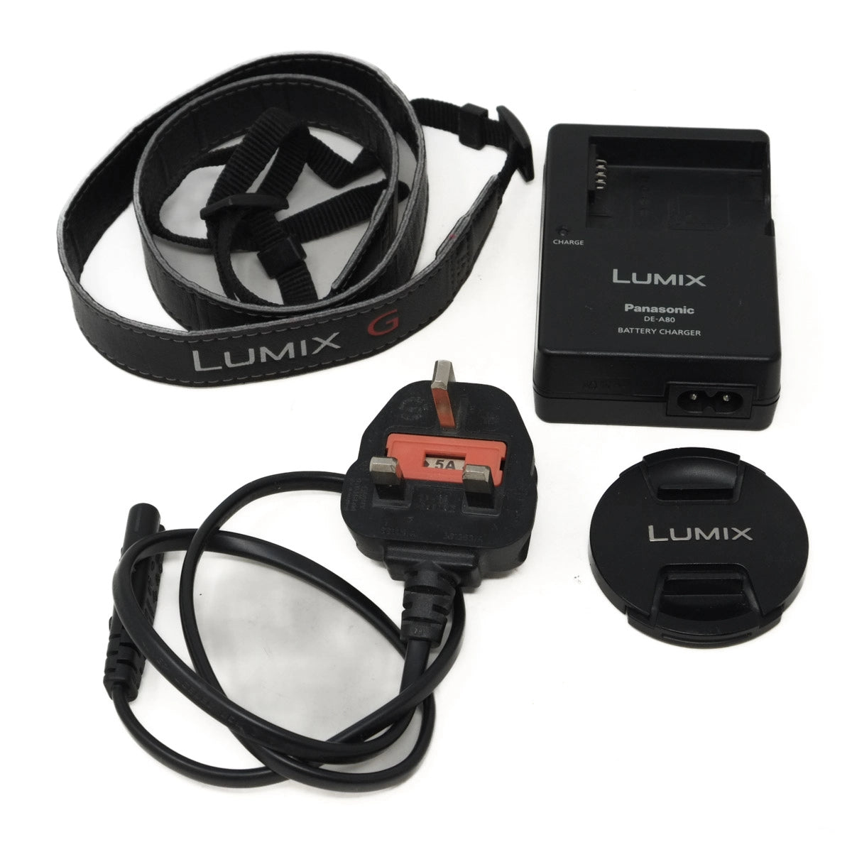 Lumix camera accessories including a battery charger, lens cap, power cord, and strap on a white background.