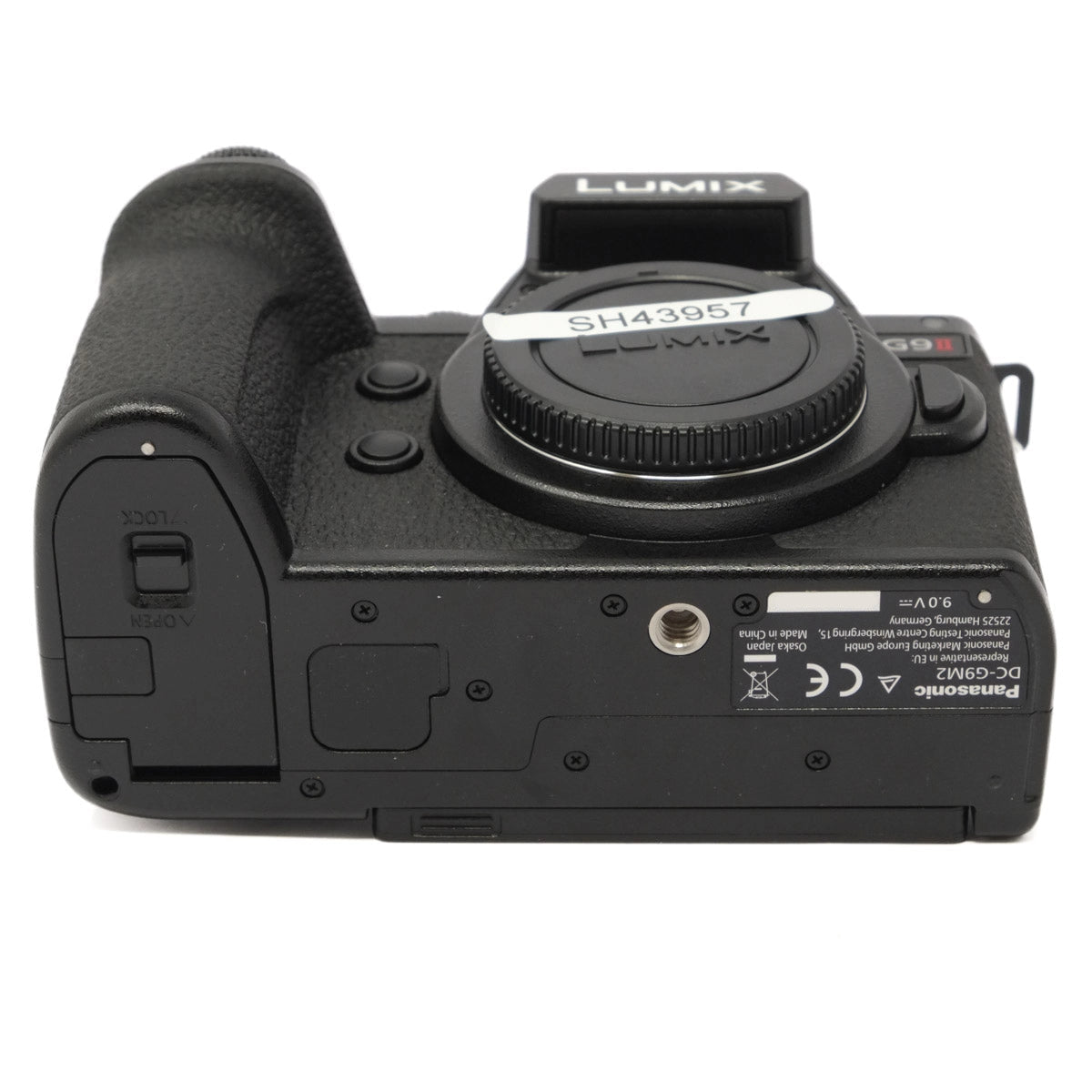 Bottom view of a Panasonic Lumix camera on a white background