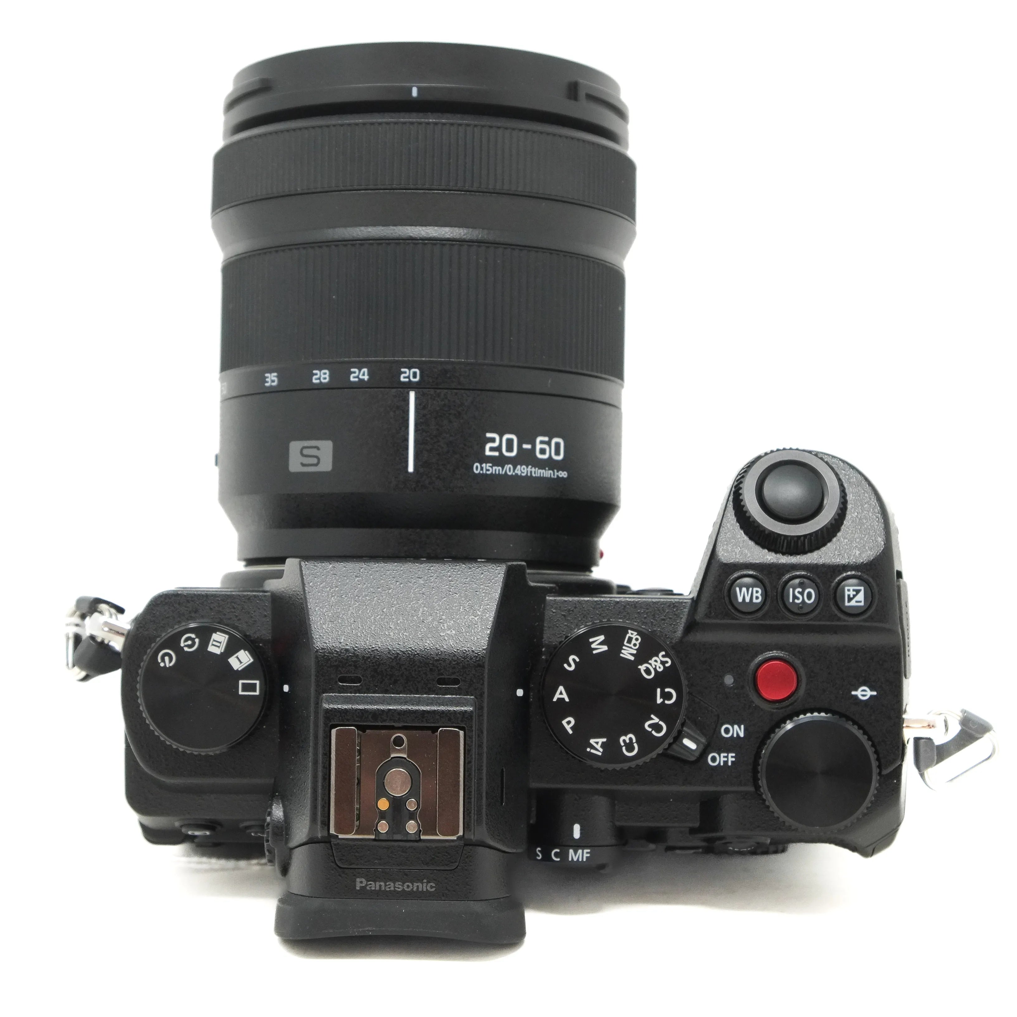 Top view of a Panasonic camera with lens on a white background