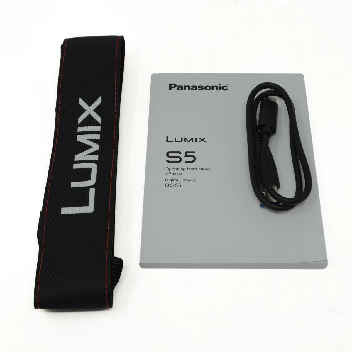 Panasonic Lumix S5 camera strap and operating instructions on a white background