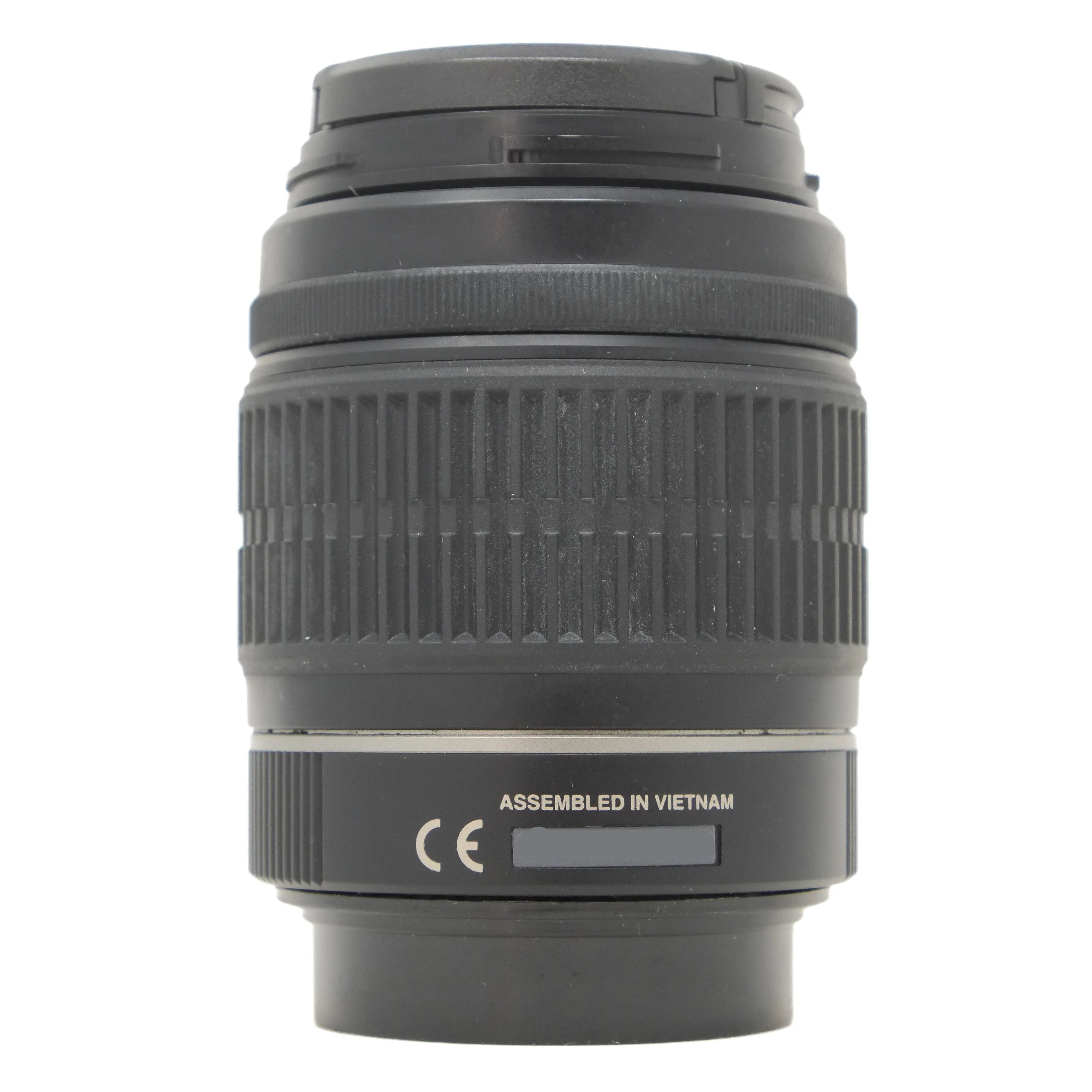 Camera lens with 'Assembled in Vietnam' label on a white background