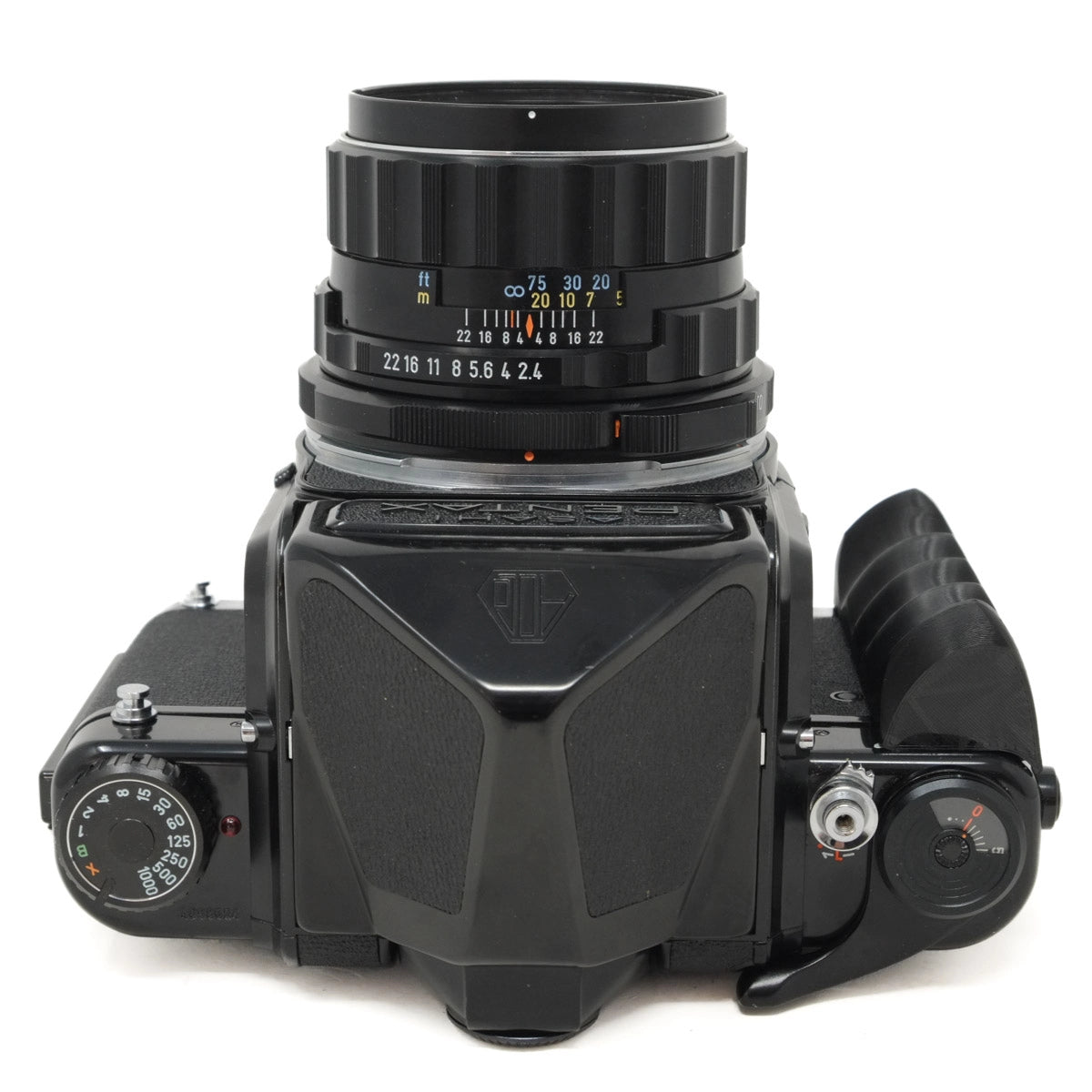 Vintage camera with lens and control dials on a white background