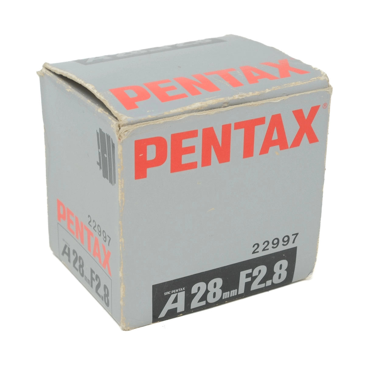 Pentax camera lens box with red text on a white background