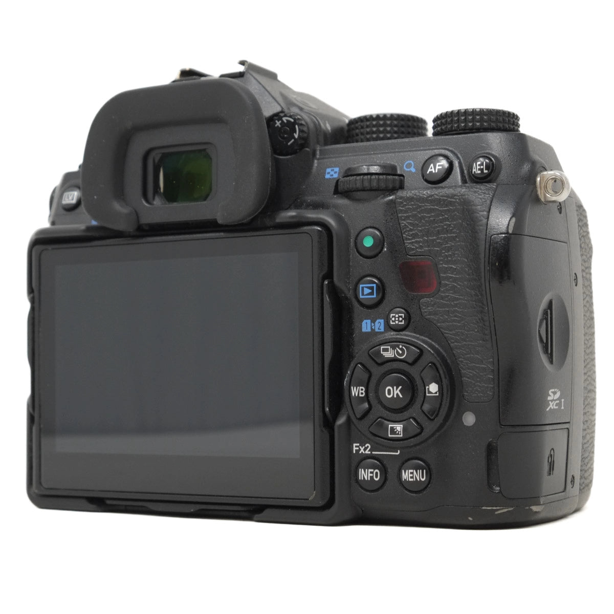 Back view of a black camera with control buttons on a white background