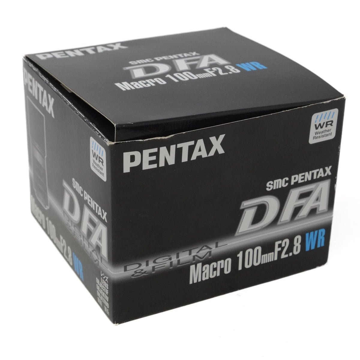 Pentax DFA camera lens packaging on a white background