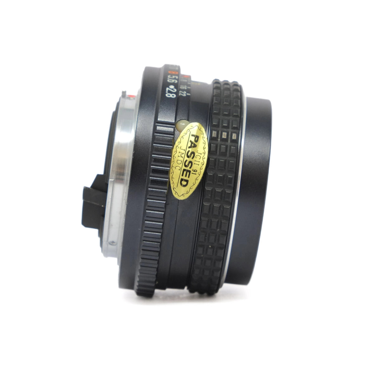 Camera lens with a gold 'Passed' label on a white background