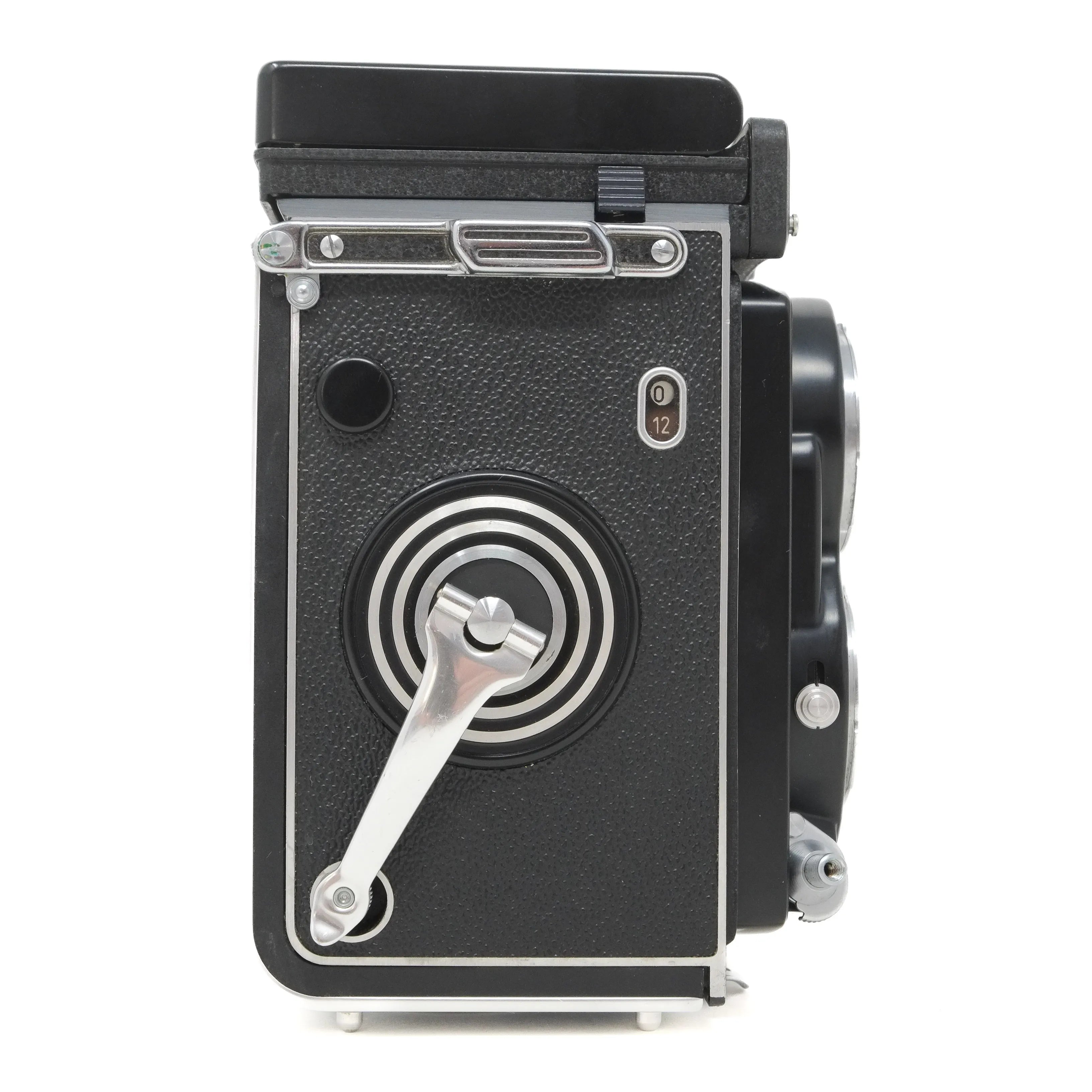 Vintage camera with a black body and silver accents on a white background