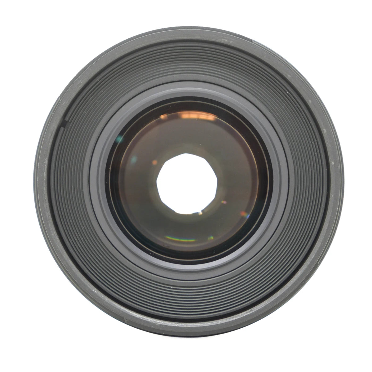 A close-up, top-down view of a circular camera lens with concentric rings and a reflective glass center, isolated on a white background.
