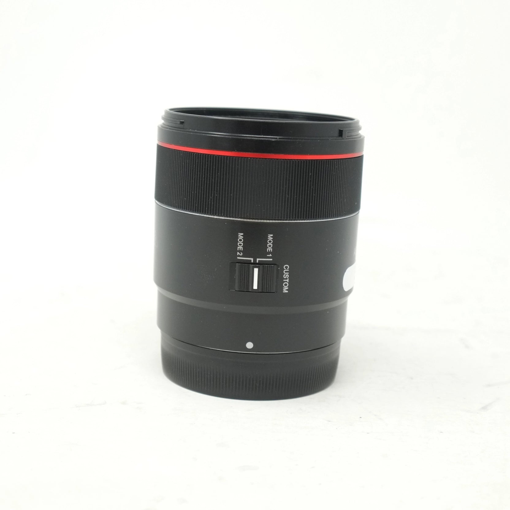 Camera lens with control buttons on a white background