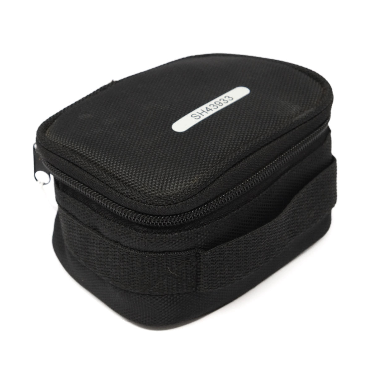 Black travel bag with a label on a white background