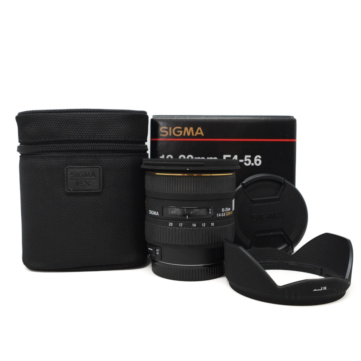 Sigma camera lens with case and hood on a white background