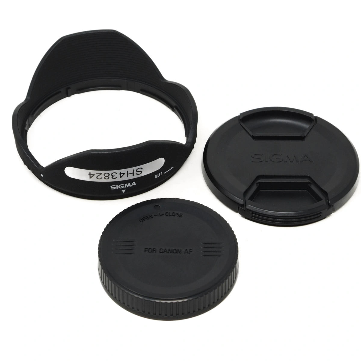 Sigma camera lens caps and hood on a white background