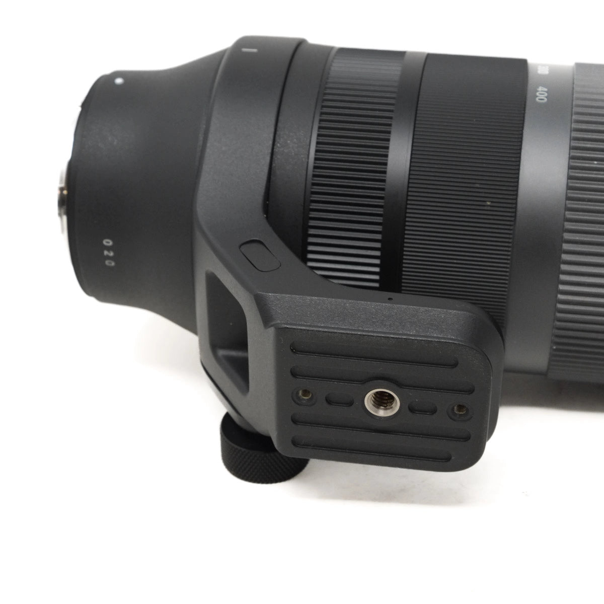 Close-up of a camera lens with a focus on the mount and design details.