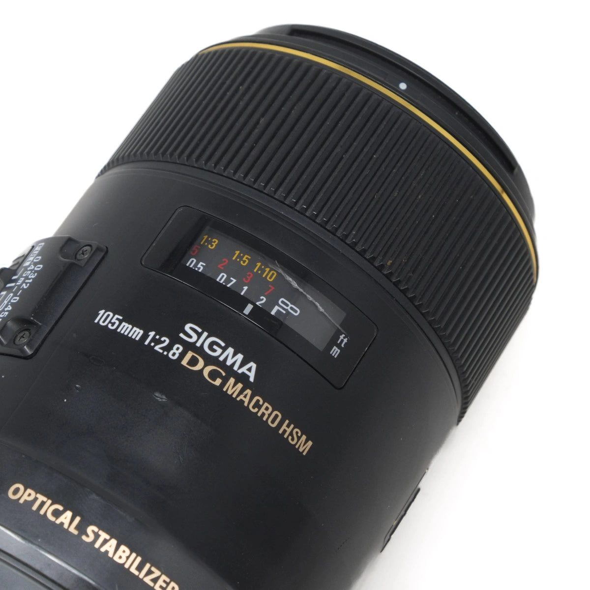 Sigma camera lens with focus and aperture information on a white background