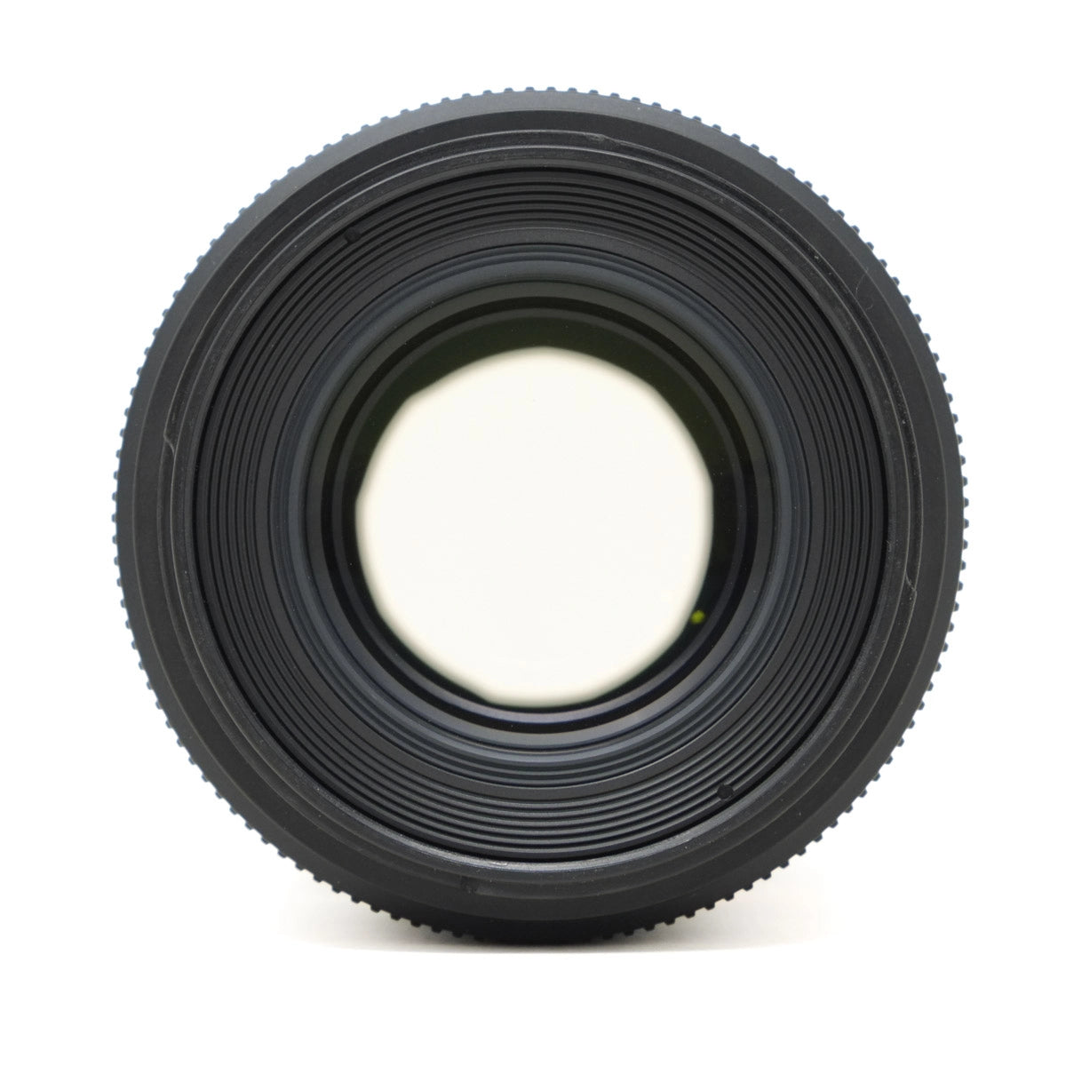 Black camera lens on a white background