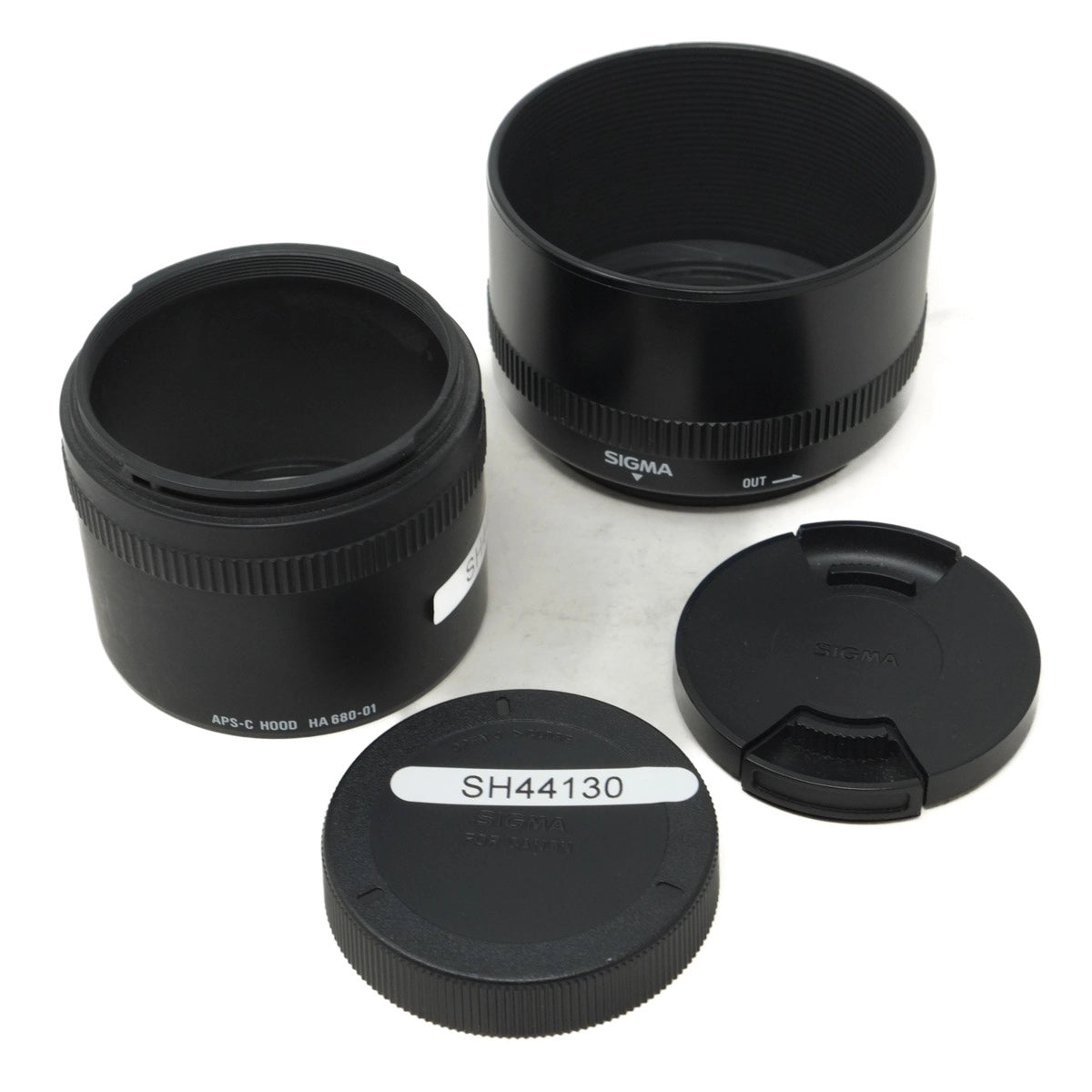 Sigma camera lens components on a white background