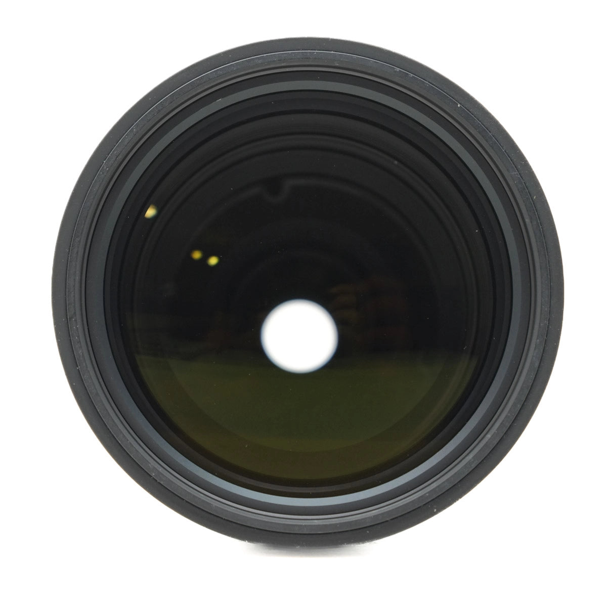 Close-up of a camera lens on a white background