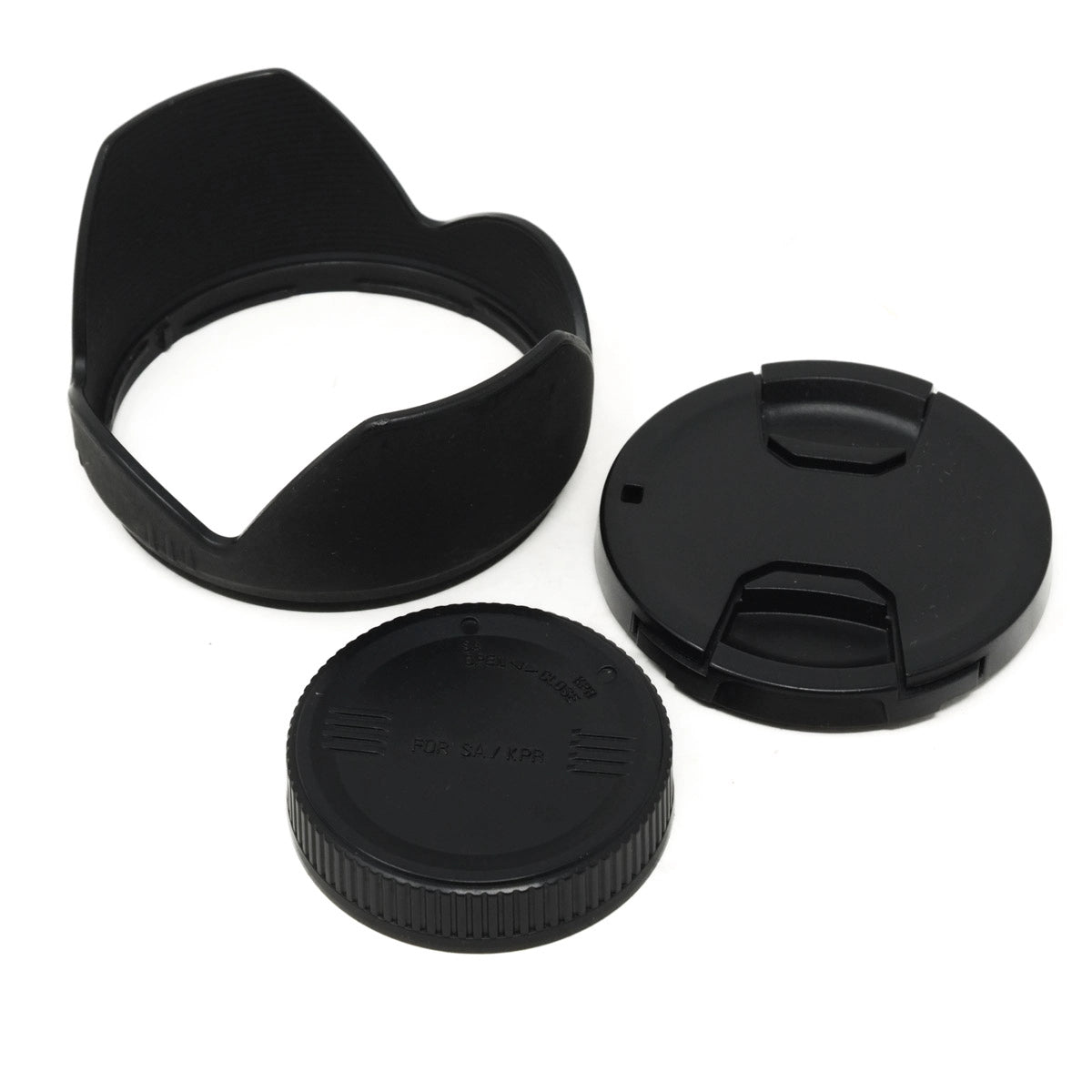 Three black camera lens accessories on a white background