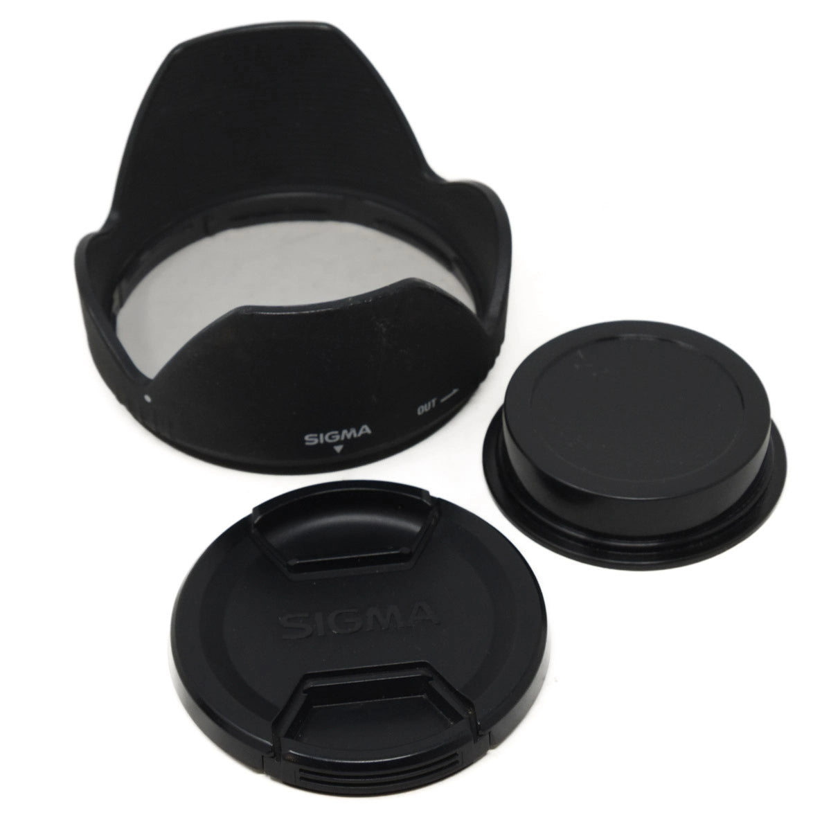 Sigma camera lens cap and hood set on a white background
