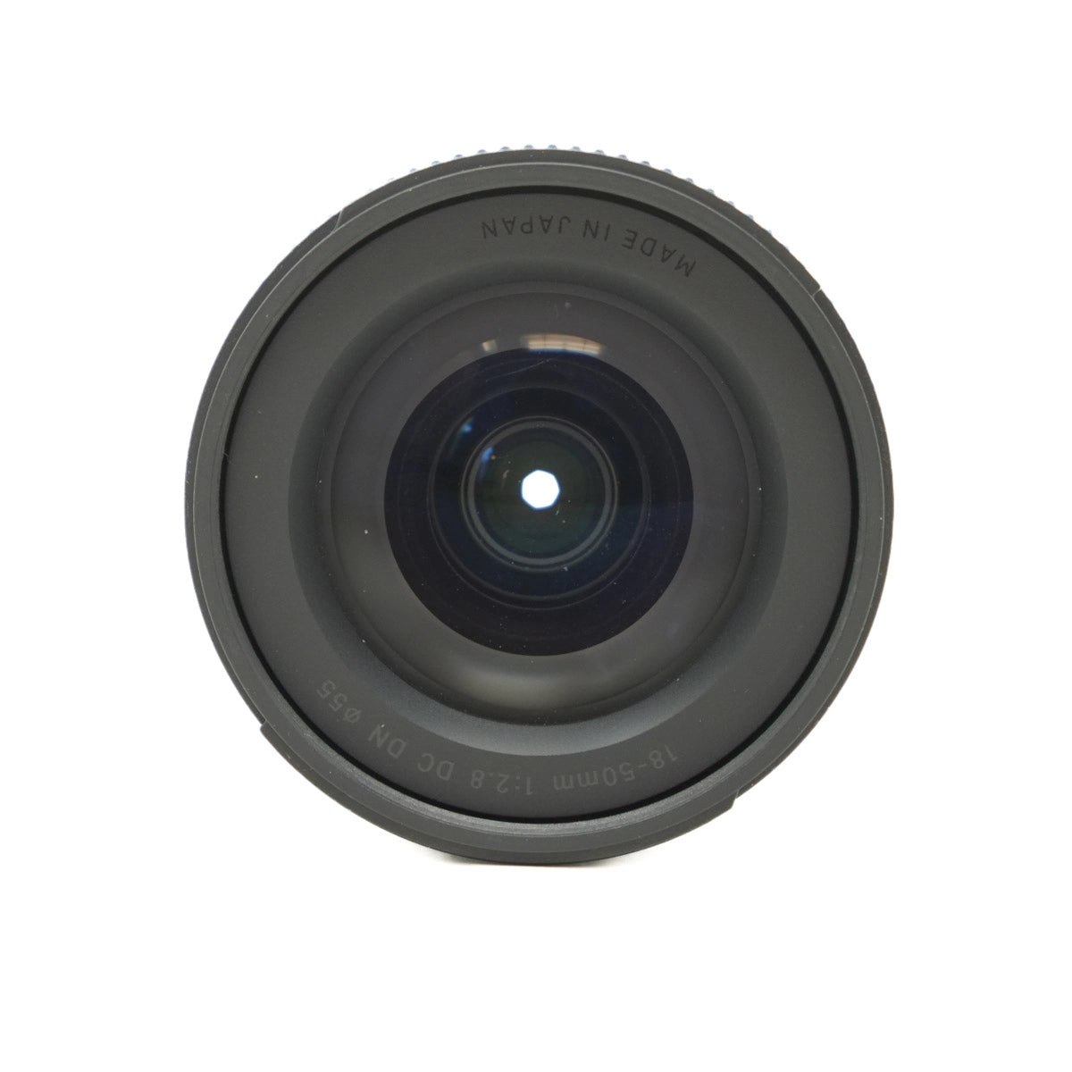 Camera lens with 'Made in Japan' text on a white background